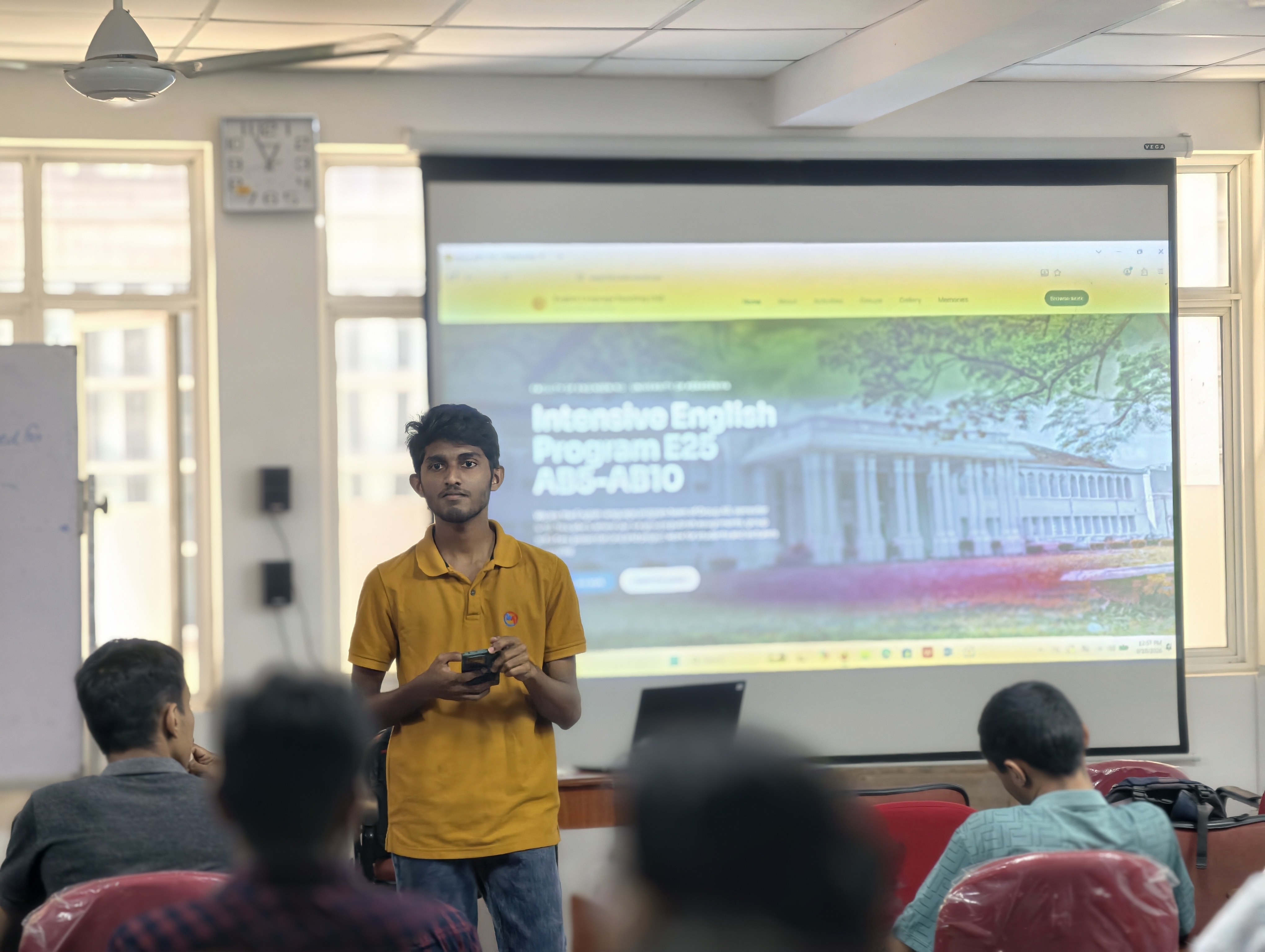 A committee member demoing the site to classmates
